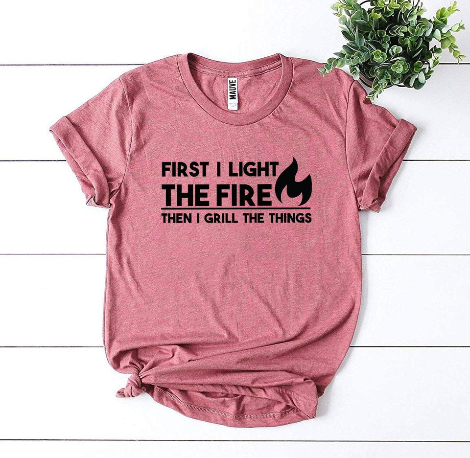 First I Light The Fire T-shirt - A Woman Knows Best