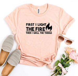 First I Light The Fire T-shirt - A Woman Knows Best