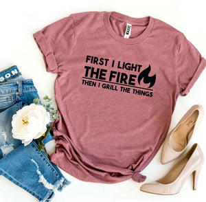 First I Light The Fire T-shirt - A Woman Knows Best