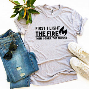 First I Light The Fire T-shirt - A Woman Knows Best